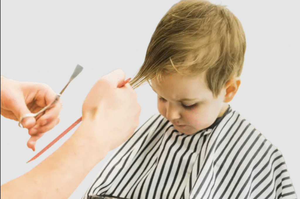 First Haircut for Babies and Toddlers in Pasadena Baby boy getting his first haircut with scissors at The Great Bear Cut in Pasadena