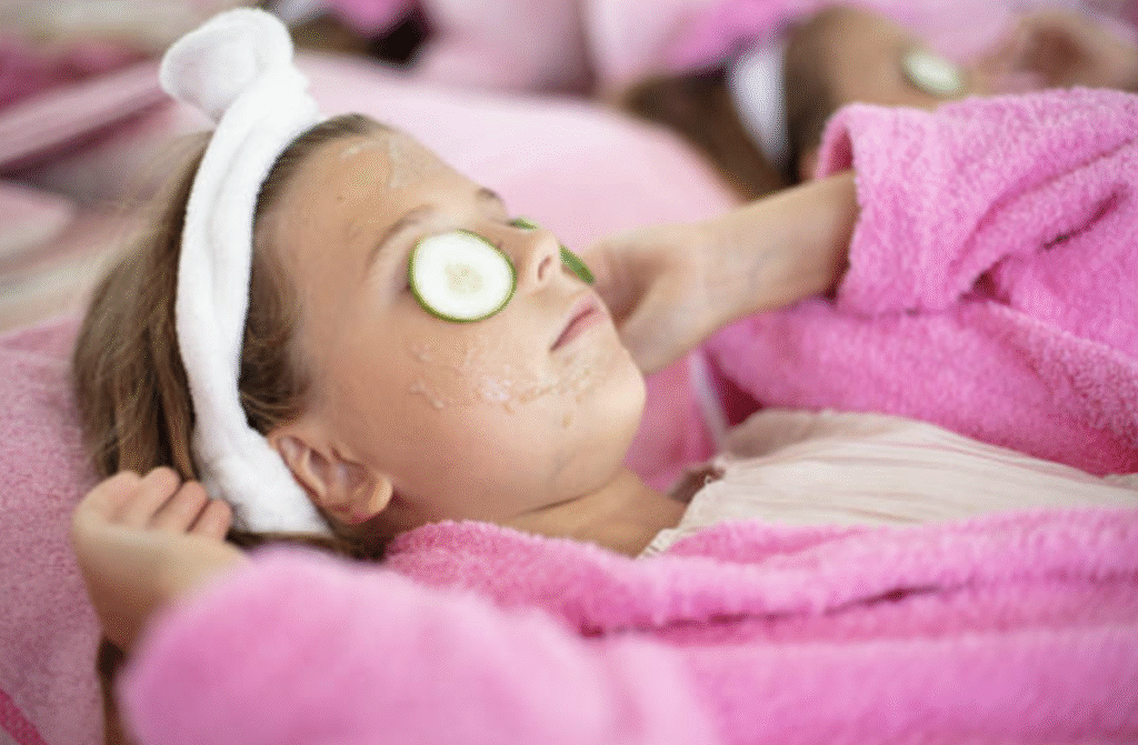 Kids Spa Girl Relaxing with Cucumber Eyes in Pasadena Young girl in a pink robe relaxing with cucumber slices on her eyes at The Great Bear Cut Kids Spa in Pasadena